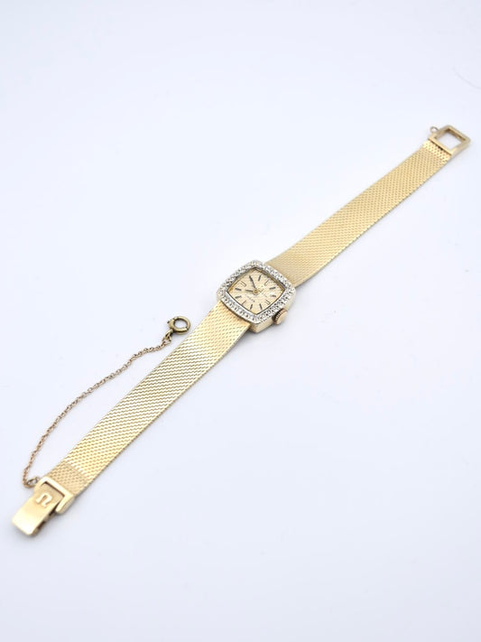vintage 14K Gold Omega vendu au détail par Tiffany & Co. Diamond Montre-bracelet