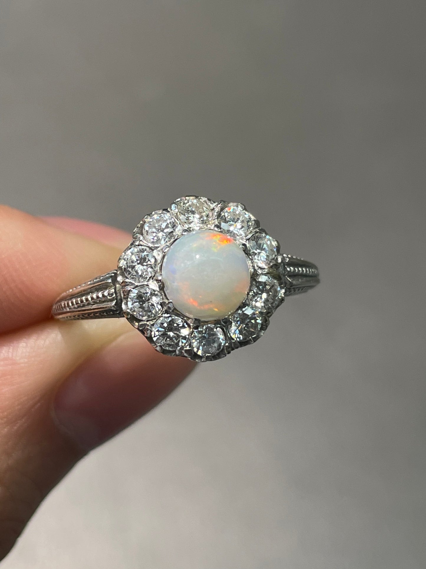 Antique French 18K White Gold Opal 0.80 CTW Diamond Halo Ring