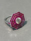 Bague halo octogonale rubis et diamants en or 18 carats de style Art déco