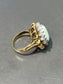 Bague vintage en or 14 carats avec opale et halo de diamants