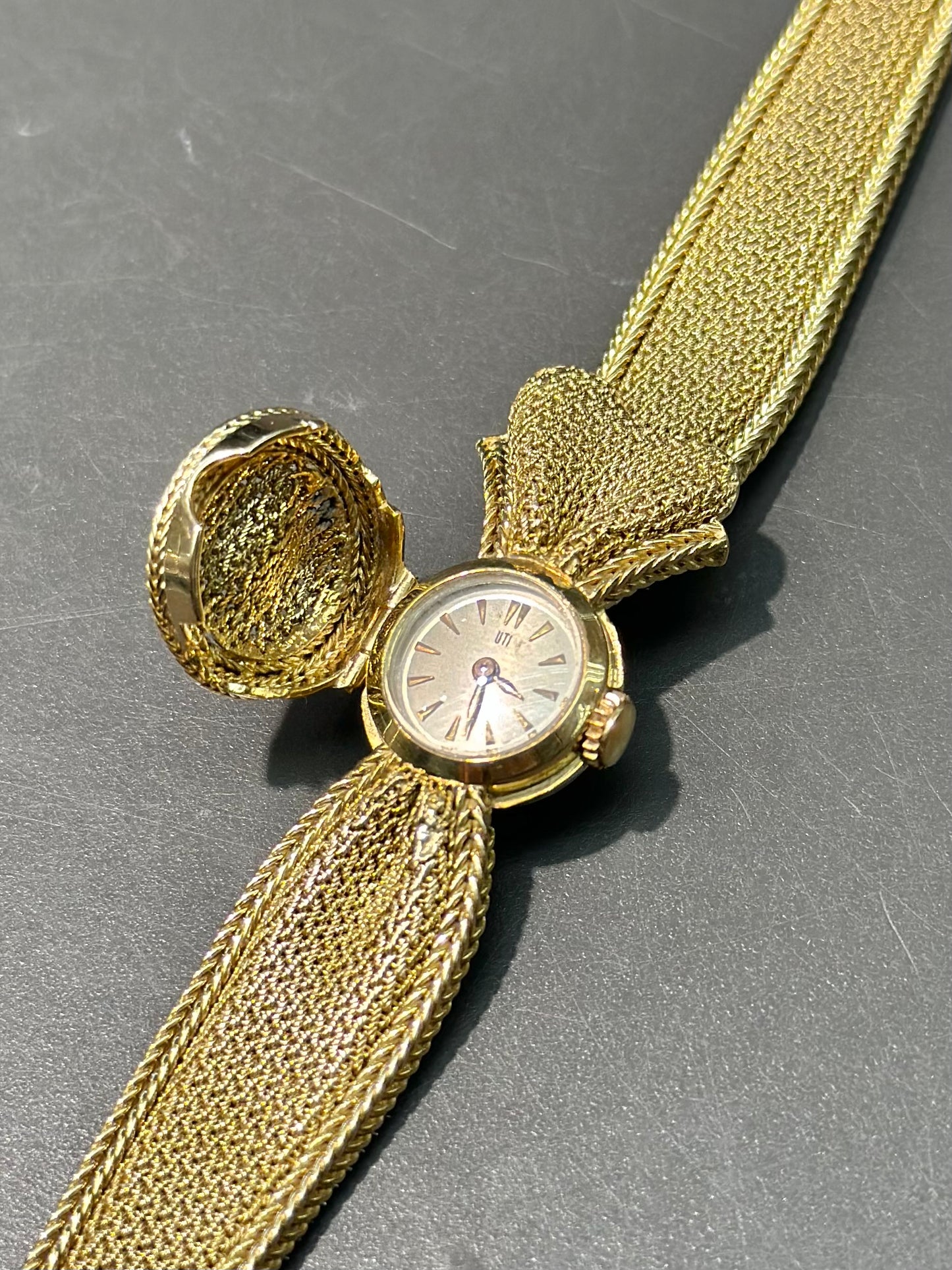 Montre à nœud caché UTI vintage en or 14 carats 7,0 pouces