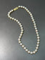 Collier de perles de culture Mikimoto en or 14 carats de 7,0 mm