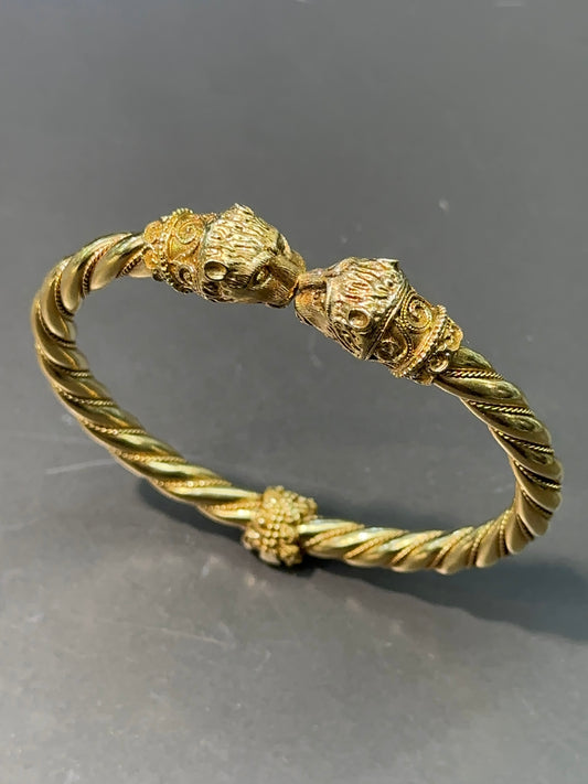 Bracelet à charnière double tête de lion vintage en or 18 carats