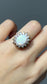 Bague vintage en or 14 carats avec opale et halo de diamants